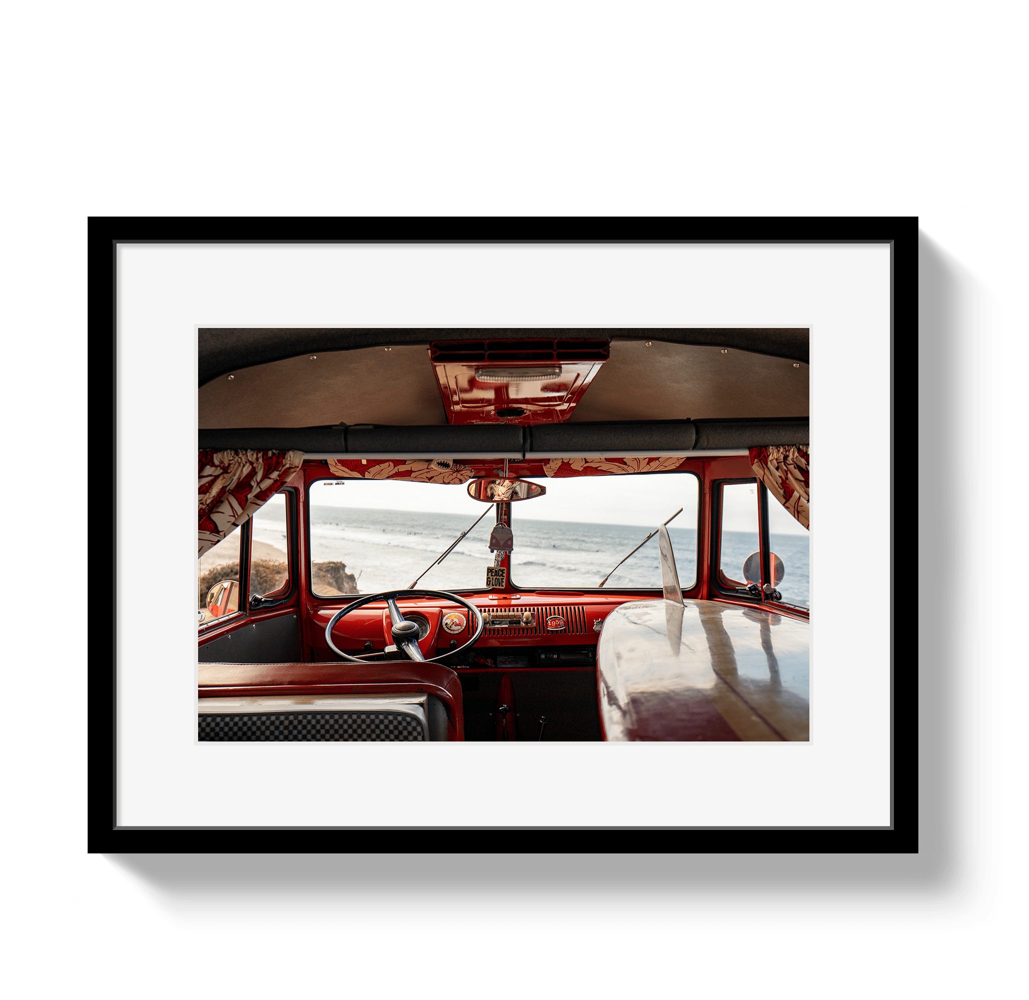 Framed photograph of a vintage vehicle interior with a scenic view.