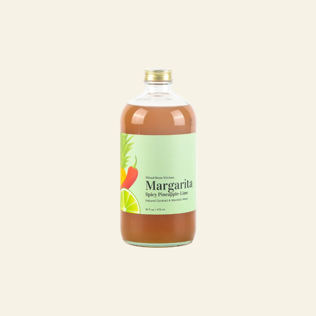 Bottle of Spicy Pineapple-Lime Margarita on a beige background