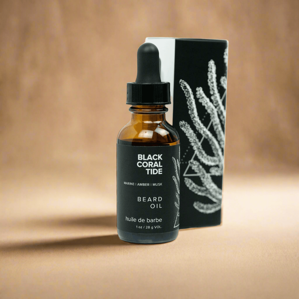 Bottle of Black Coral Tide beard oil with a dropper and packaging on a white background