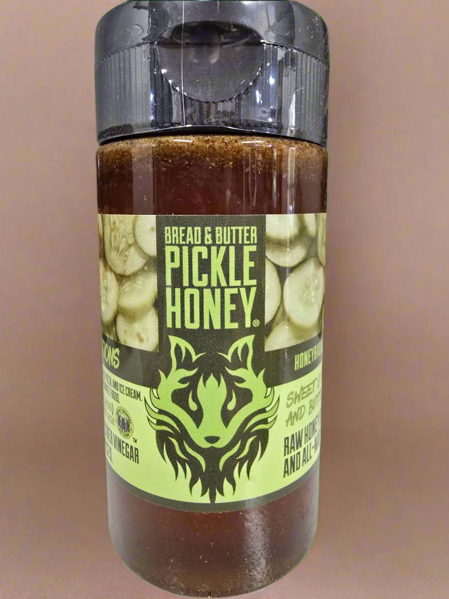 Bottle of Bread & Butter Pickle Honey with a green background