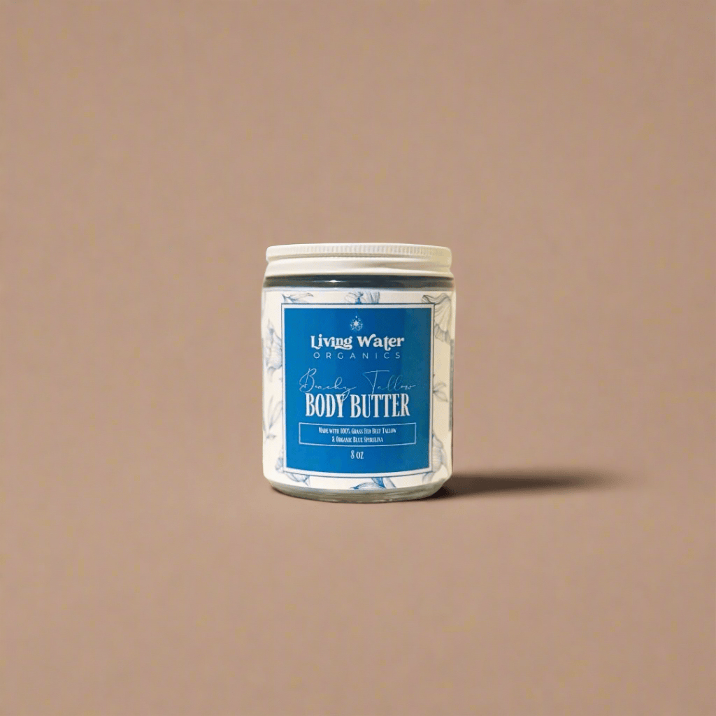 Jar of body butter with a blue label on a beige background
