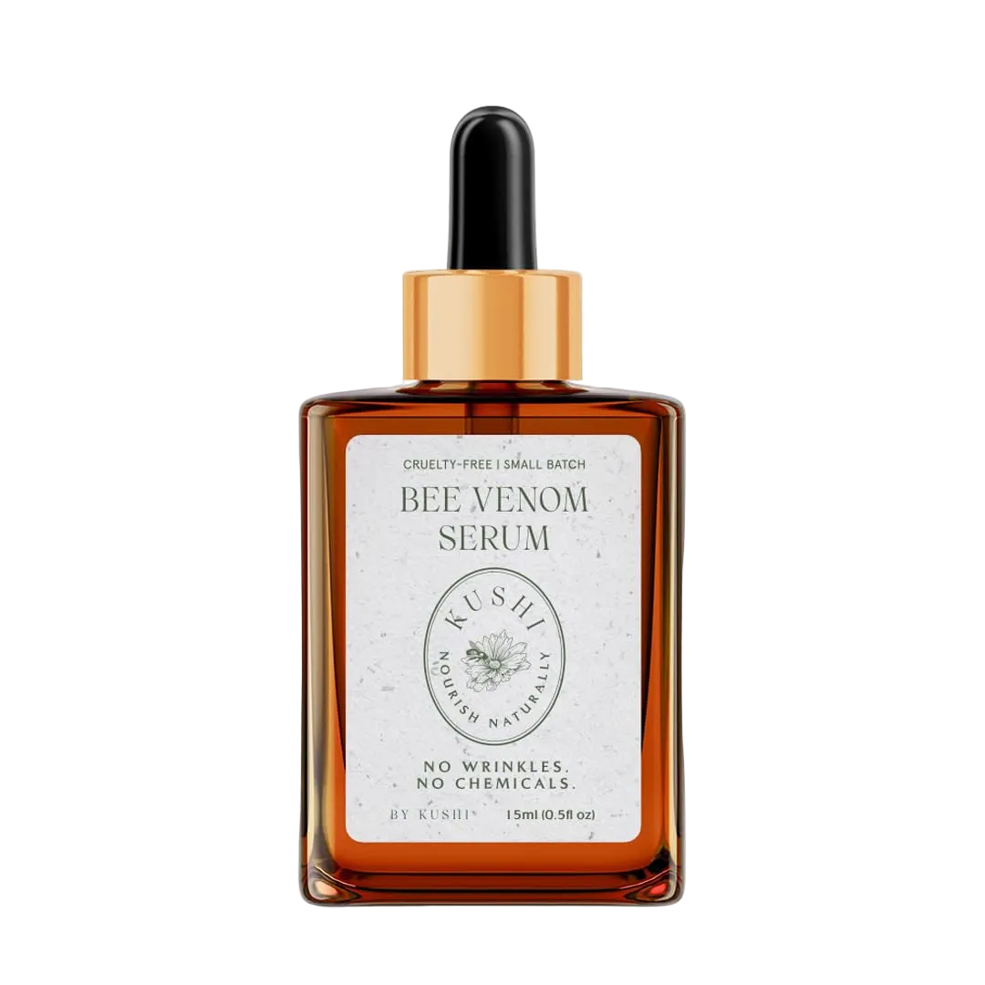 Kushi Bee Venom Serum in an amber glass dropper bottle with a gold collar and black rubber dropper, on a white background.