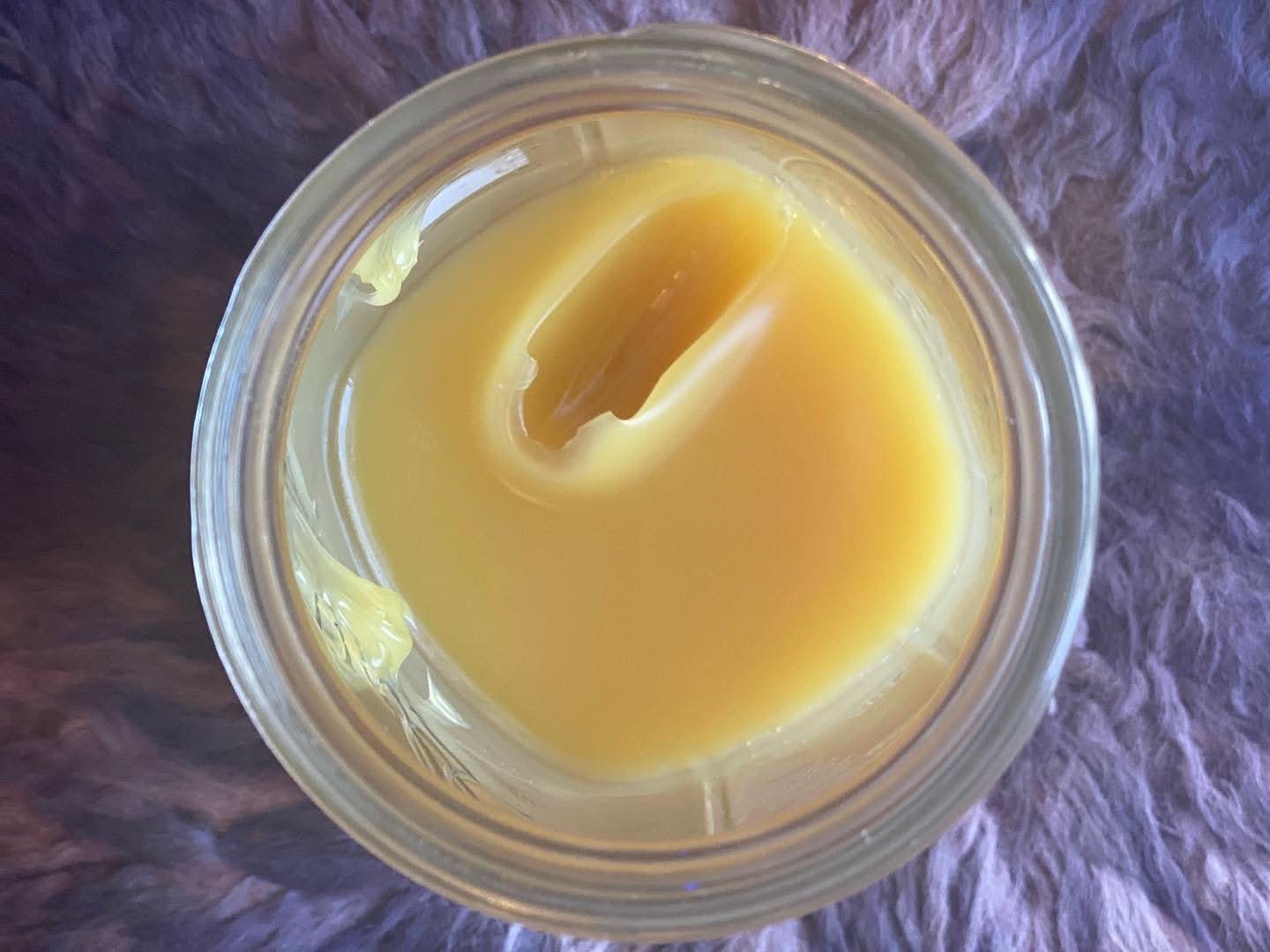 Anti-aging eye balm with lanolin, arnica, and rose otto