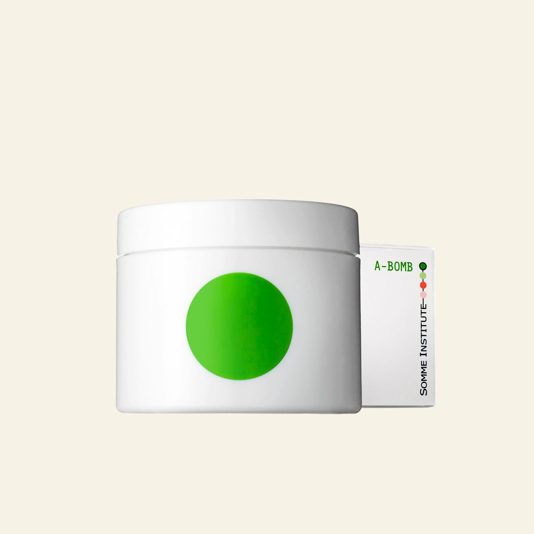 White jar with green dot and &