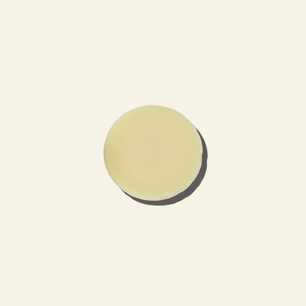 Round beige object on a light gray background