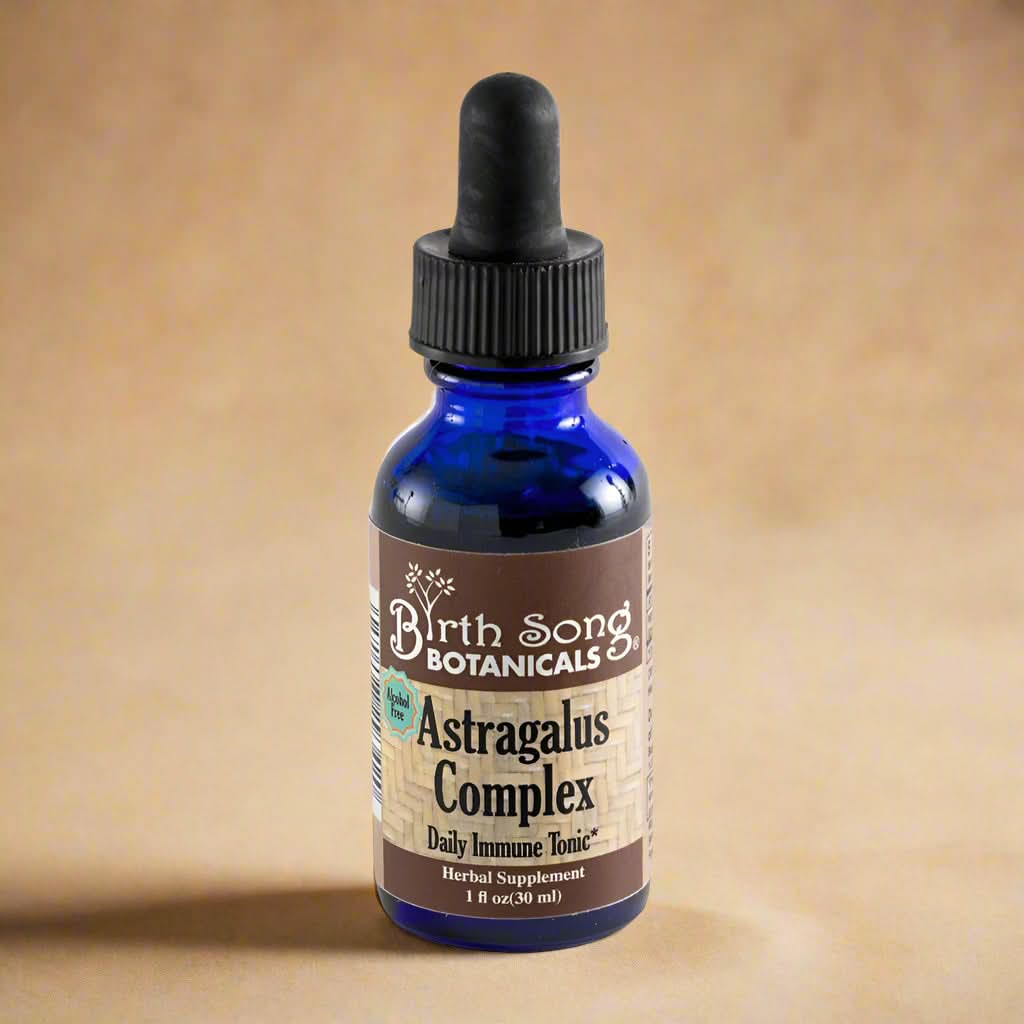 Blue glass bottle with dropper labeled &