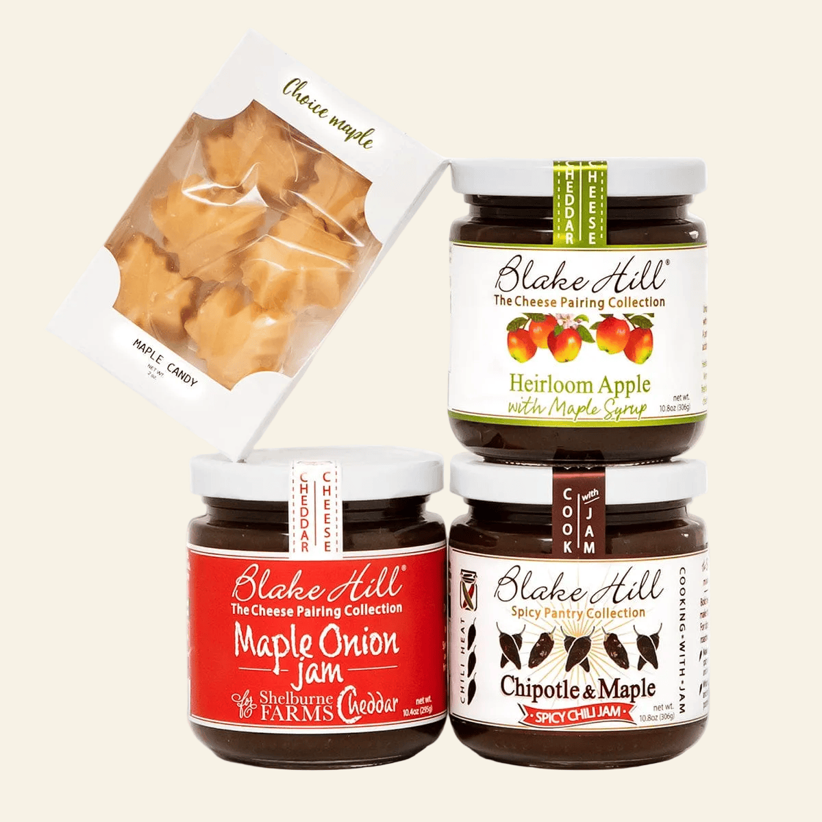 Four jars of Blake Hill cheese and jam on a white background