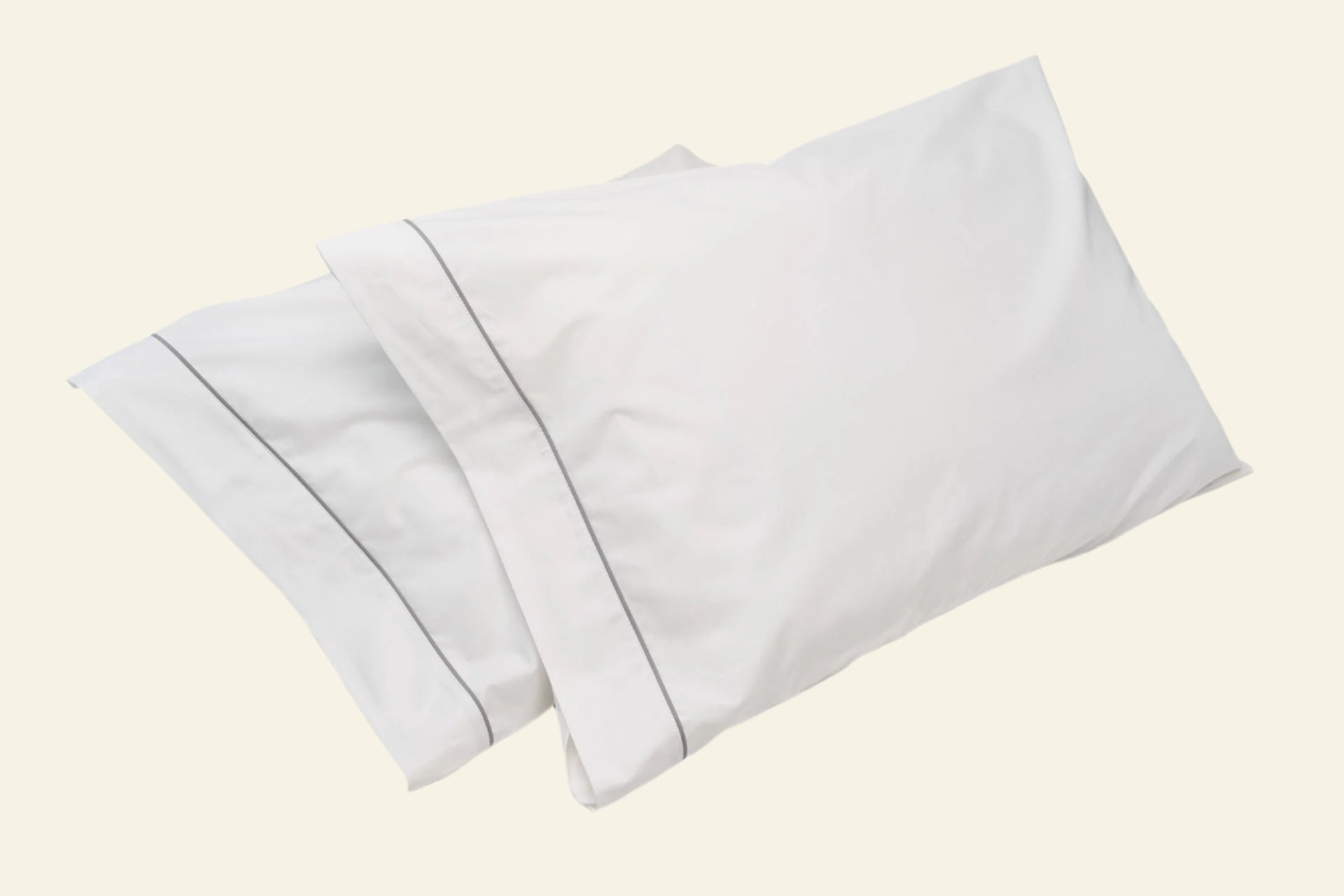 Set of white pillowcases on a light gray background