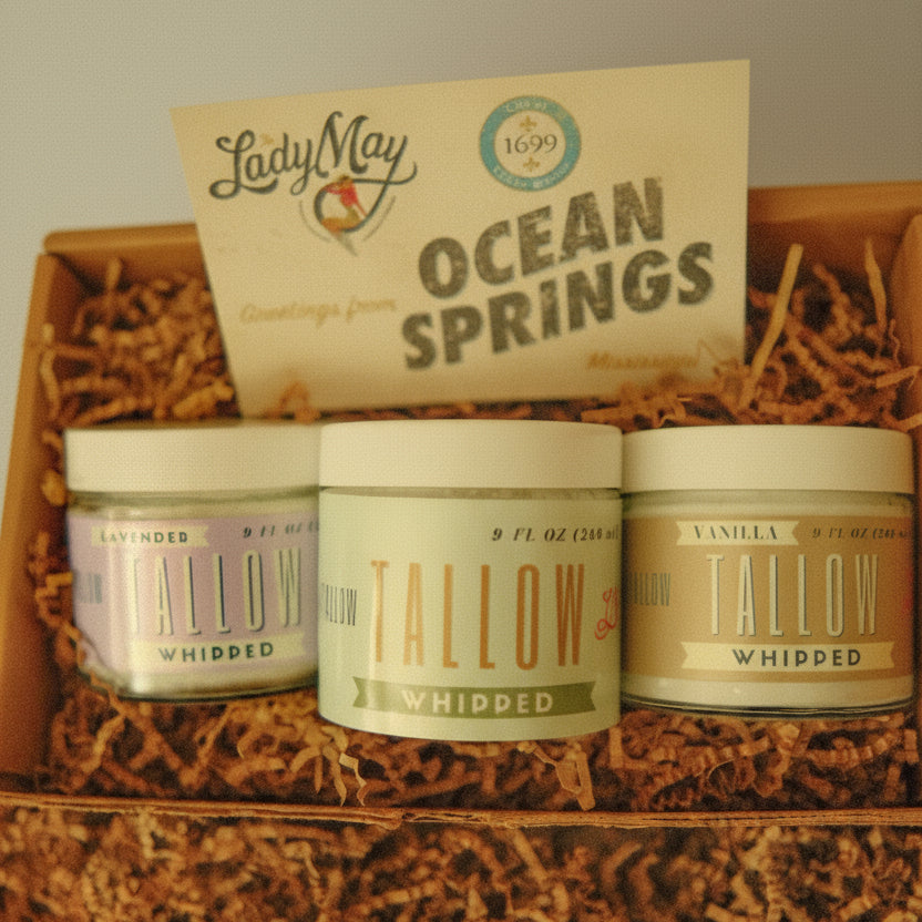 Three tallow products in a wooden box with &