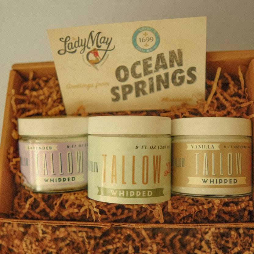 Three tallow products in a wooden box with &