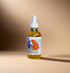 Bottle of herbal tincture with a dropper on a sandy surface