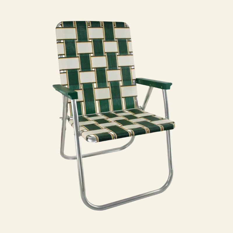 A folding patio chair with a green and cream woven pattern sling seat and backrest, supported by a silver metal tubular frame with green armrests.