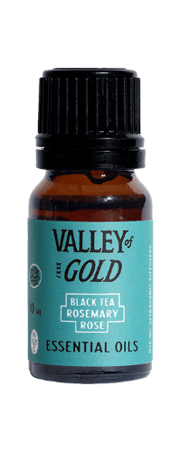 Valley of Gold essential oil bottle with black cap and teal label