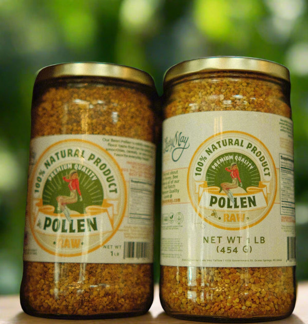 Jars of pollen on a wooden shelf with visible labels.