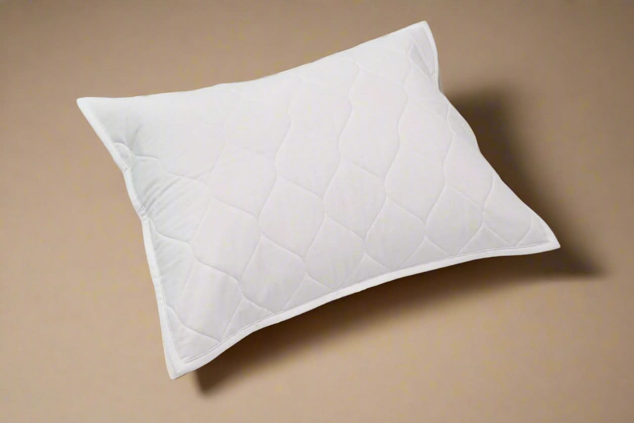 White quilted pillow on a light gray background