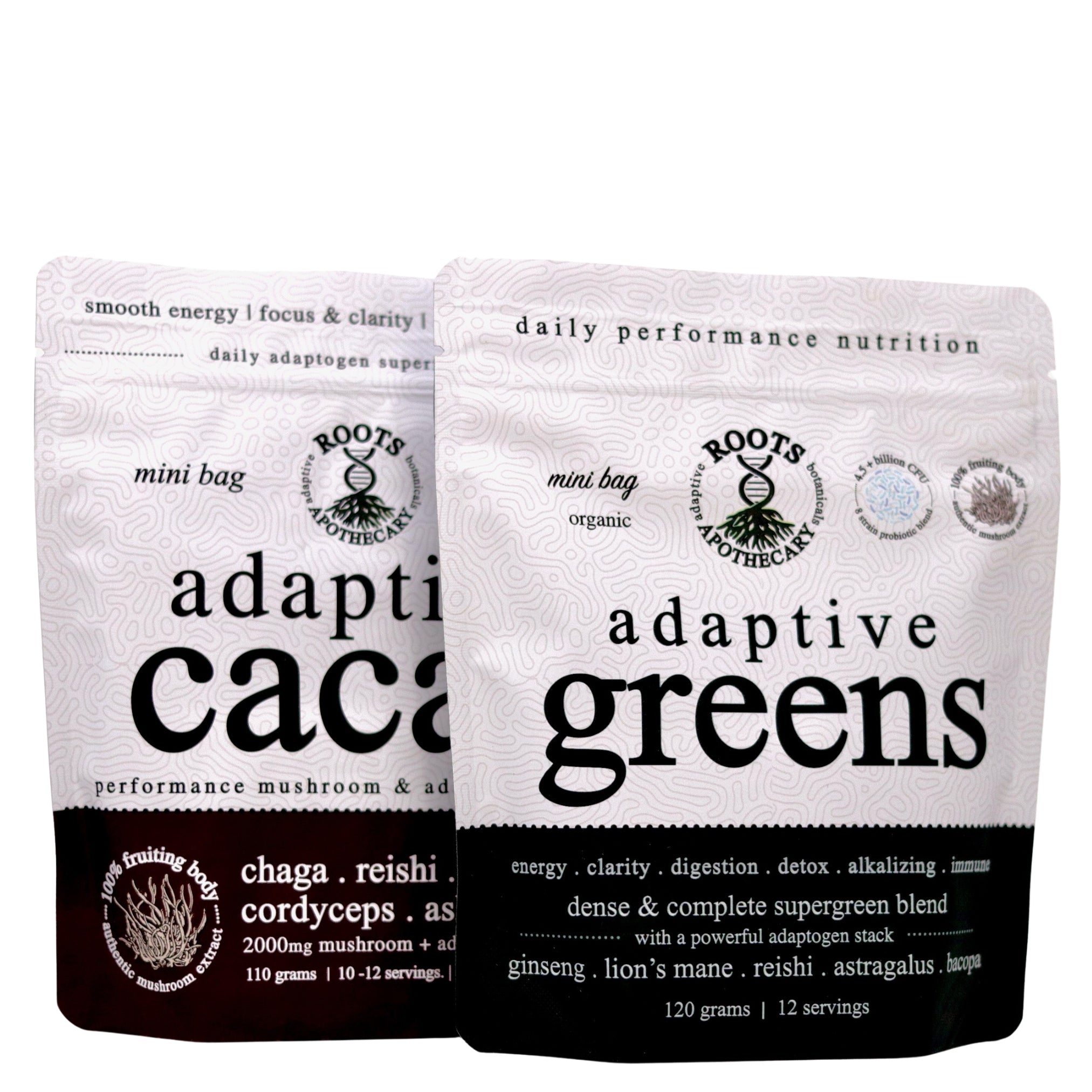 Two packages of Roots Anothecary adaptive cacao and adaptive greens on a white background