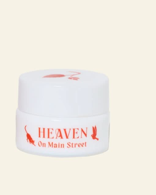 White jar with red text &