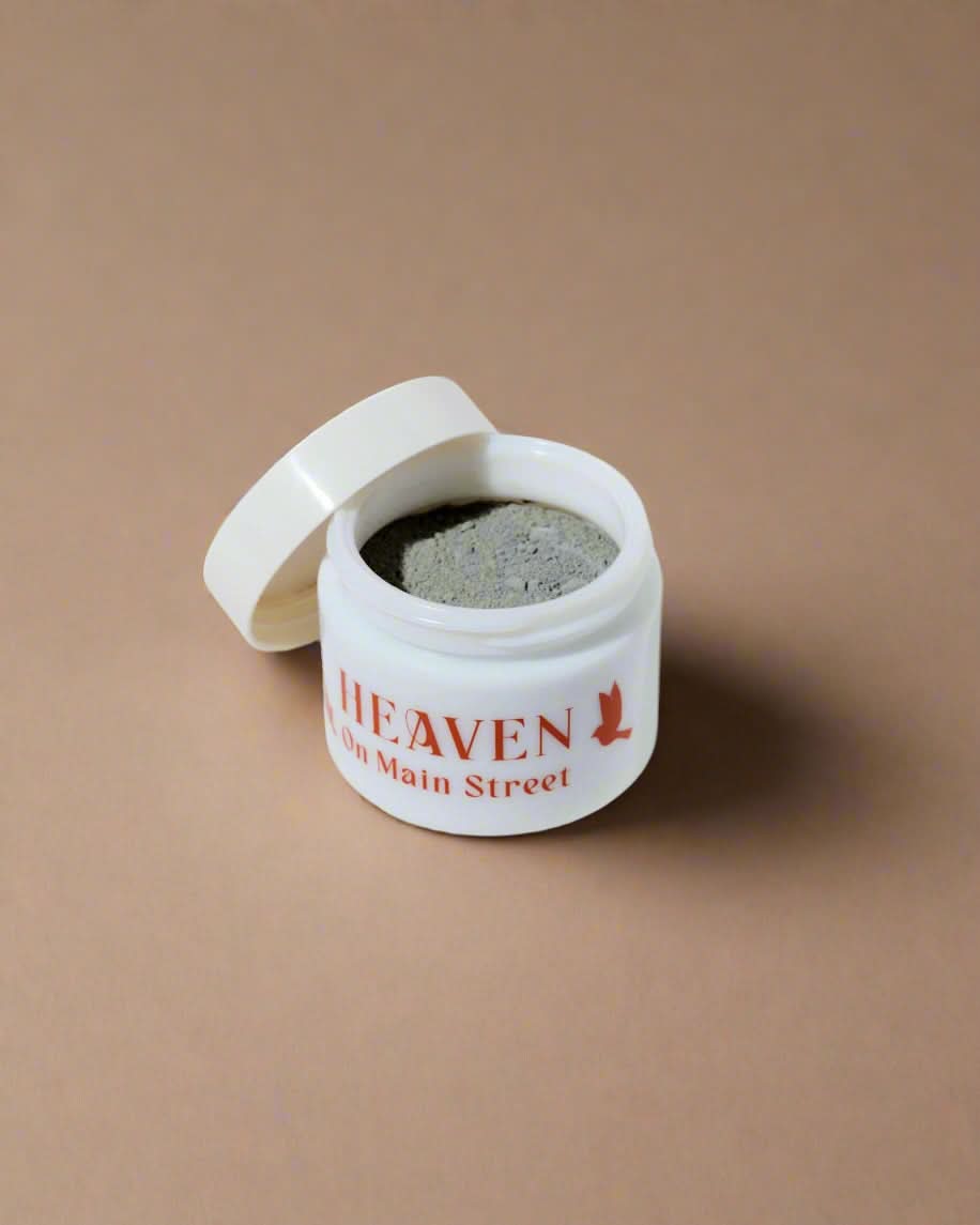 White container with gray powder labeled &