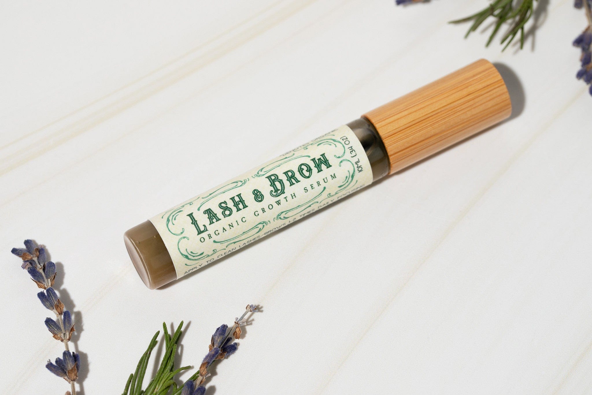 Roots and Leaves, LLC Organic Lash & Brow Serum with cold pressed castor oil and pearl powder