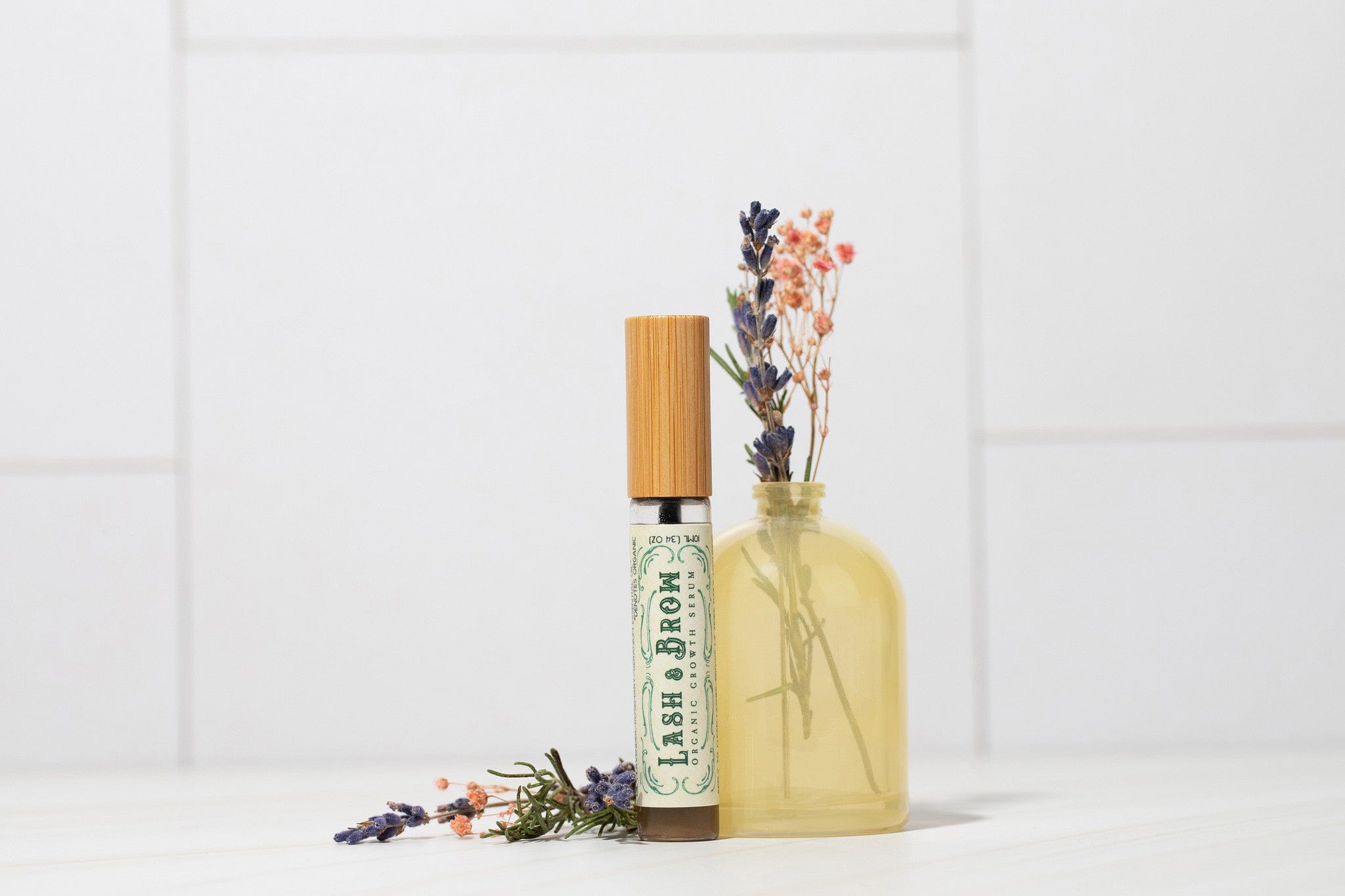 Roots and Leaves, LLC Organic Lash & Brow Serum with cold pressed castor oil and pearl powder