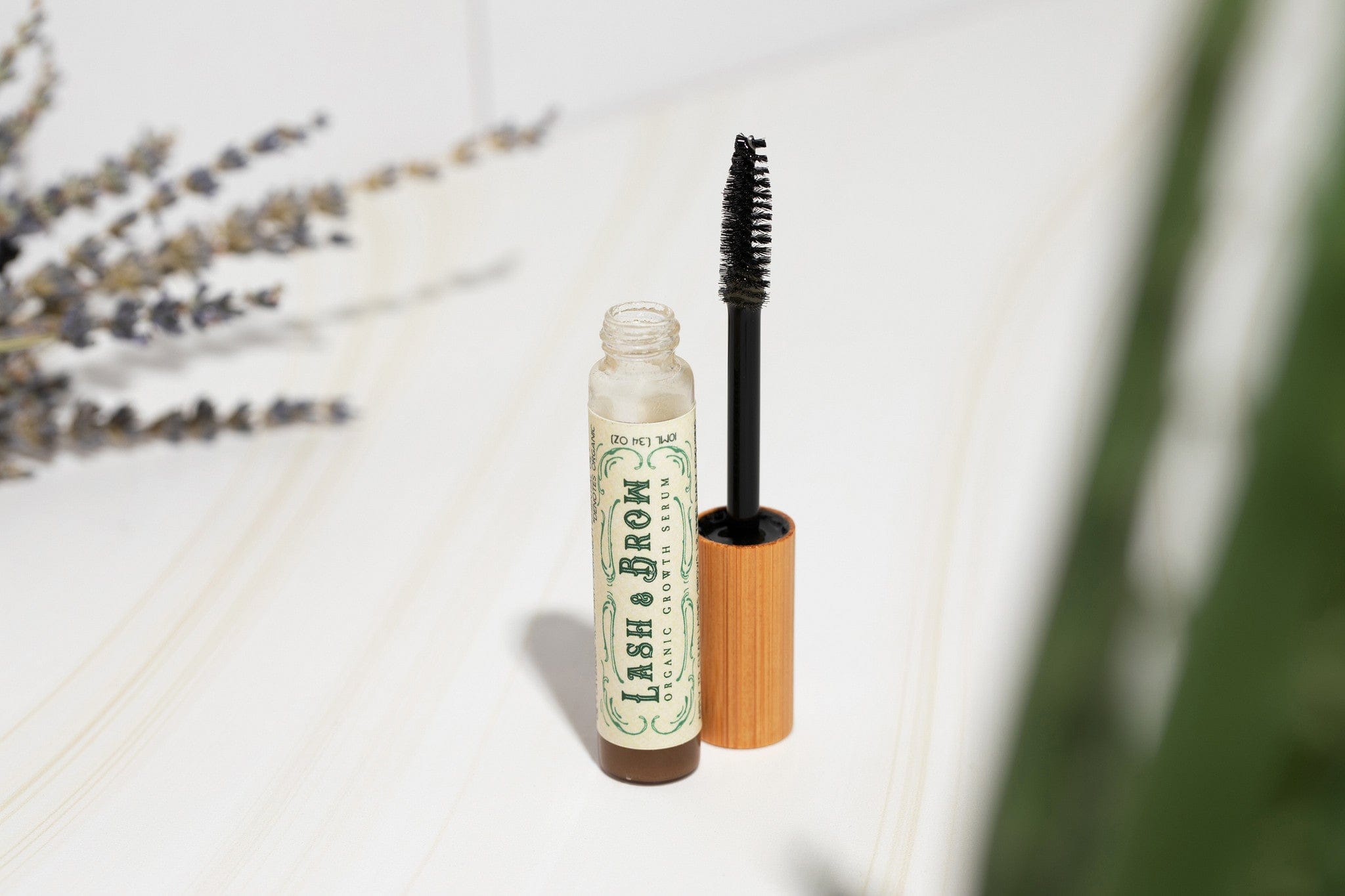 Roots and Leaves, LLC Organic Lash & Brow Serum with cold pressed castor oil and pearl powder