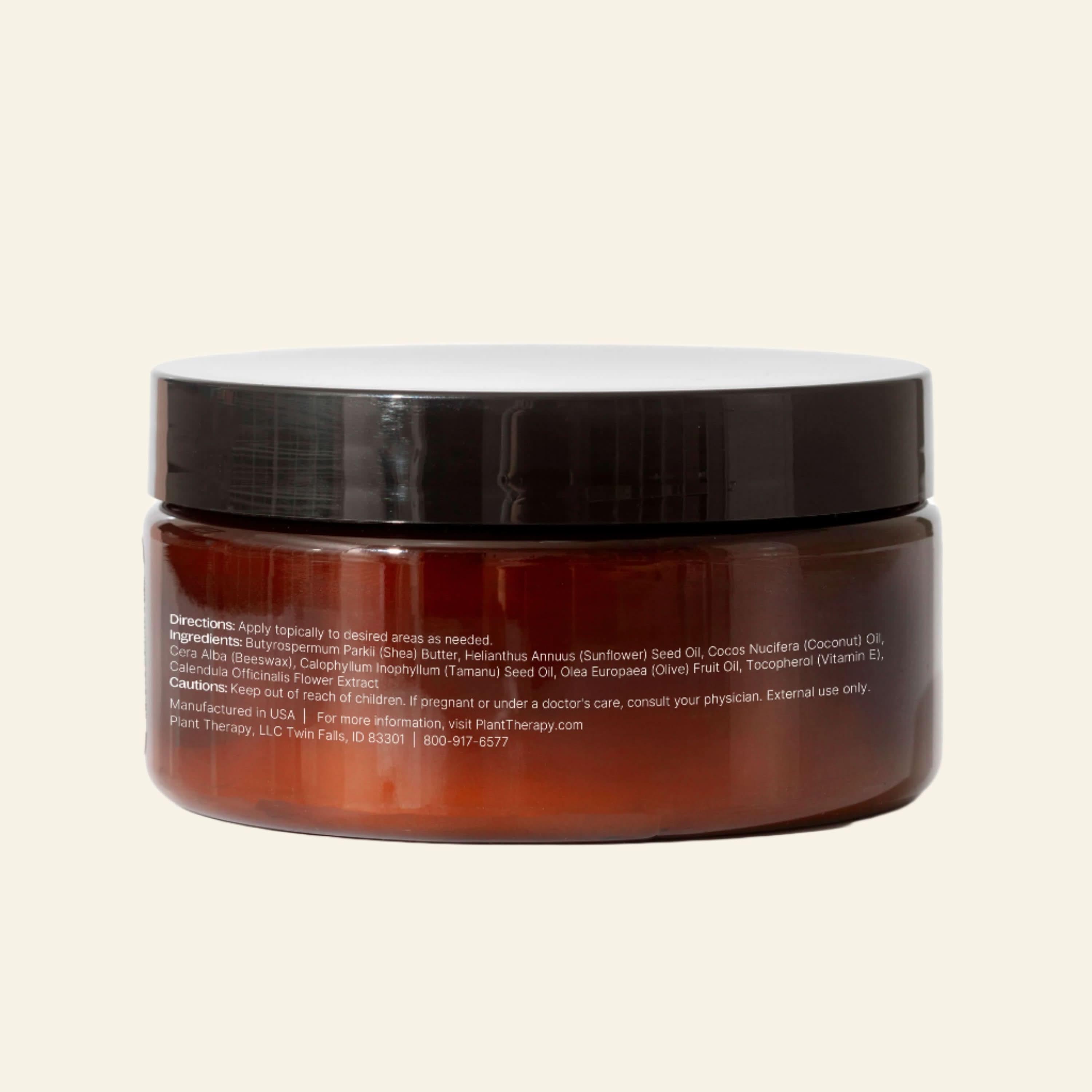 Brown jar with black lid on a white background