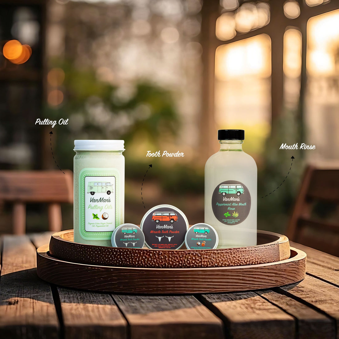 Set of VanHaus products including a jar, bottle, and coasters on a wooden tray with a blurred background.