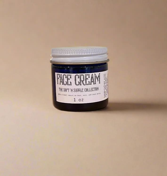 Jar of face cream with a label on a beige background