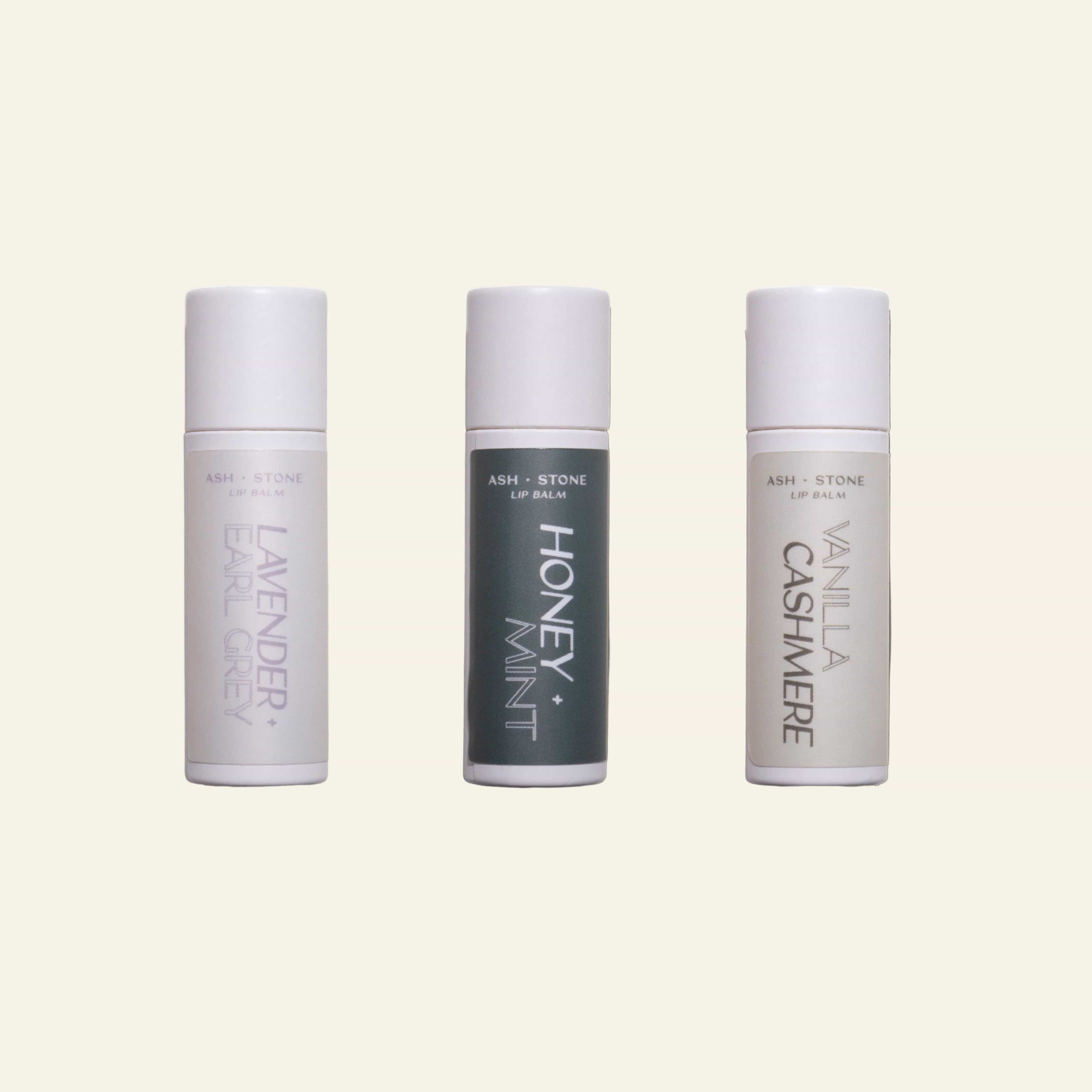 Three lip balm tubes labeled &