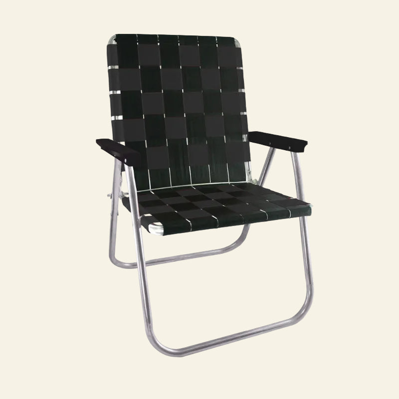 A folding outdoor lounge chair with a black woven checkered webbing pattern on the seat and backrest, supported by a silver metal tubular frame.