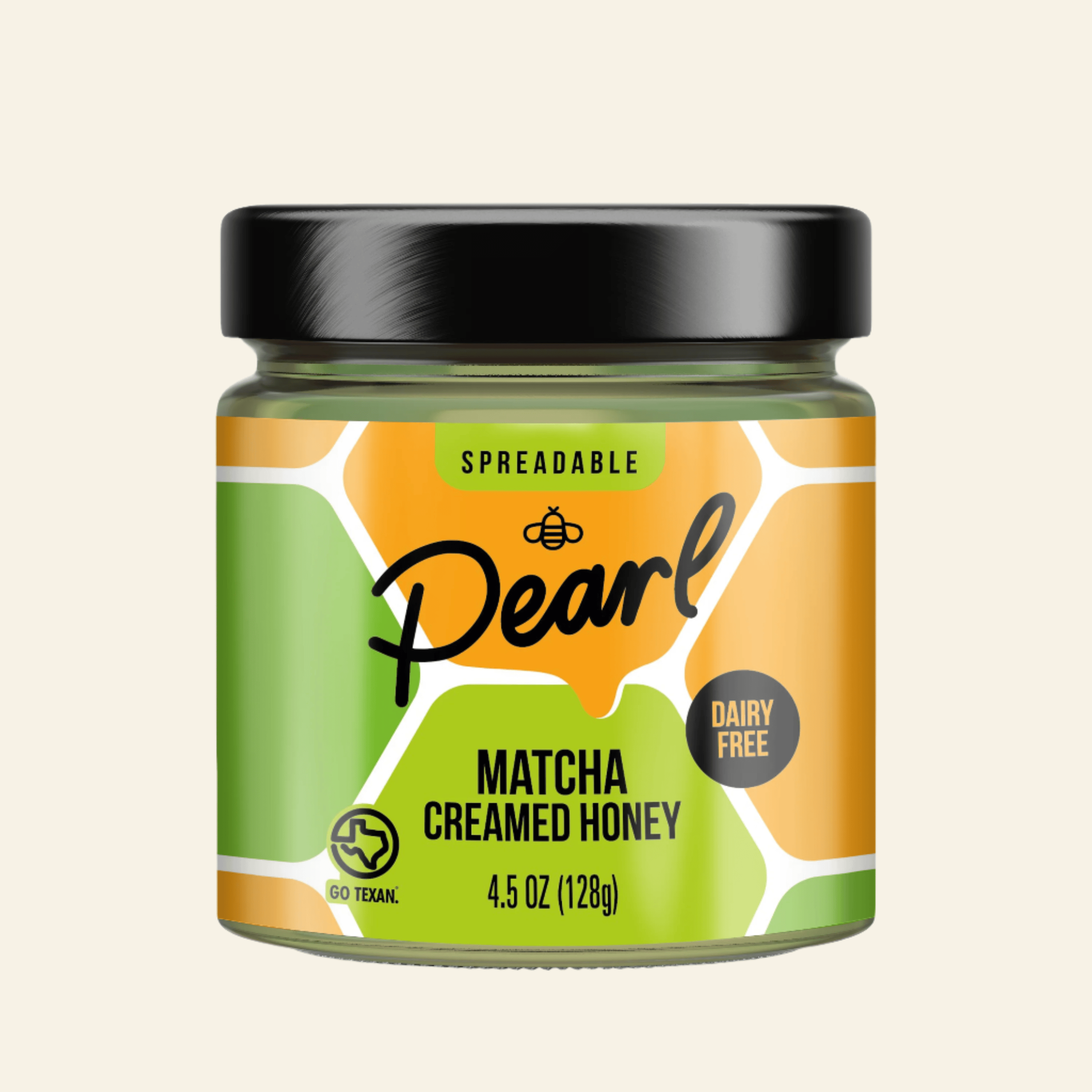 Jar of Pearl Matcha Creamed Honey with a black lid on a white background