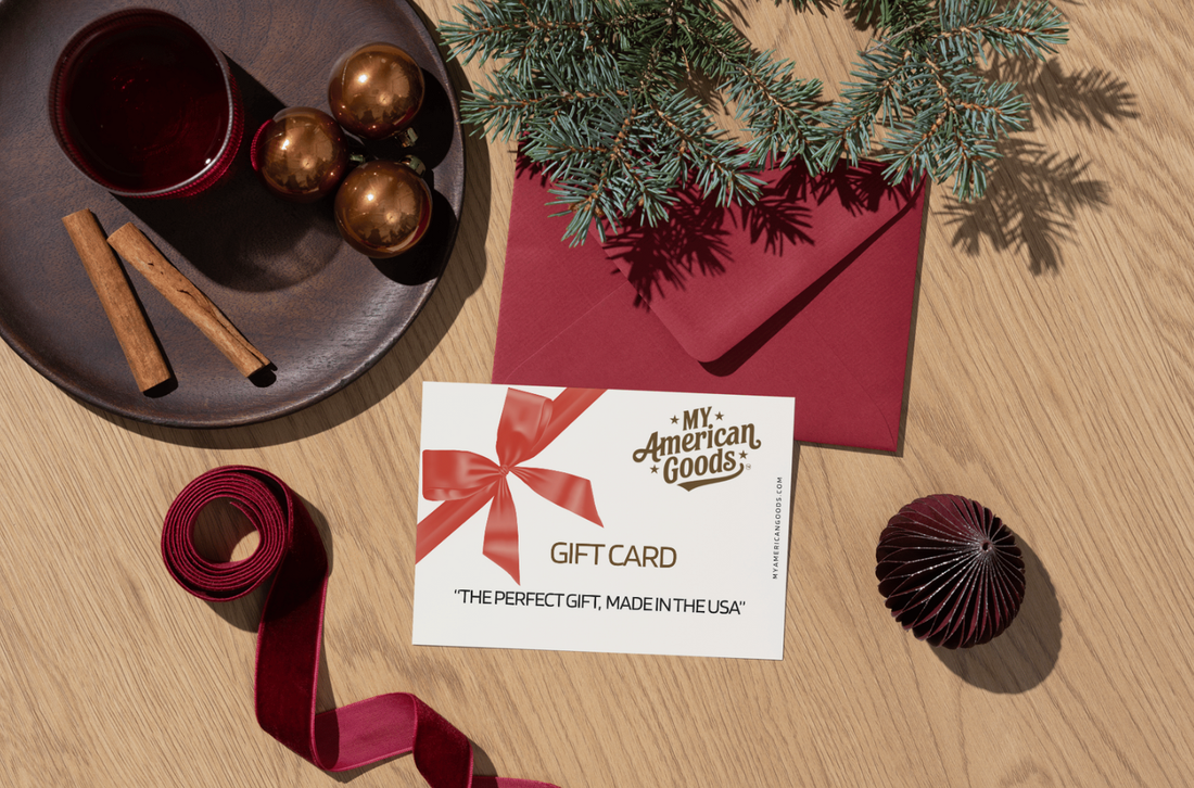 My American Goods gift card on a wooden surface with Christmas decor