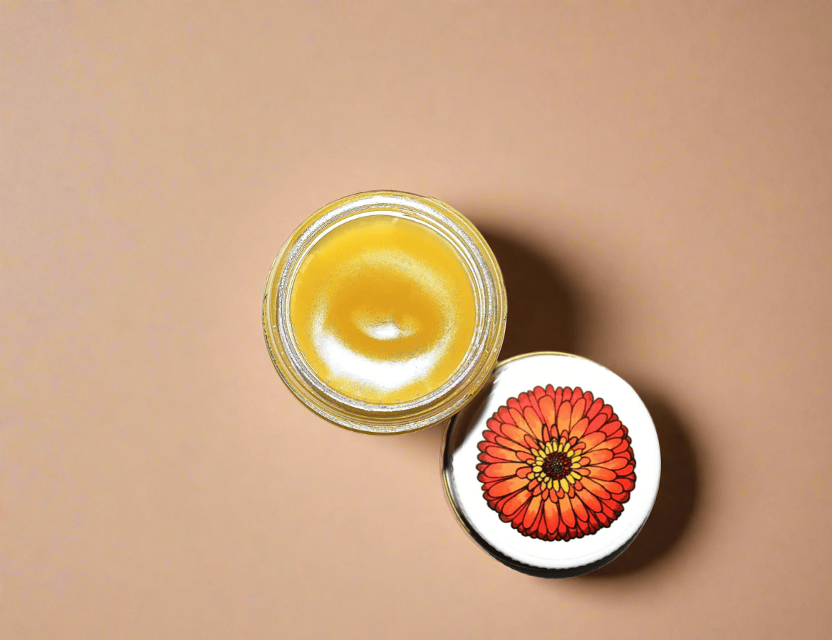 Jar of yellow cream with a red flower-shaped lid on a white background