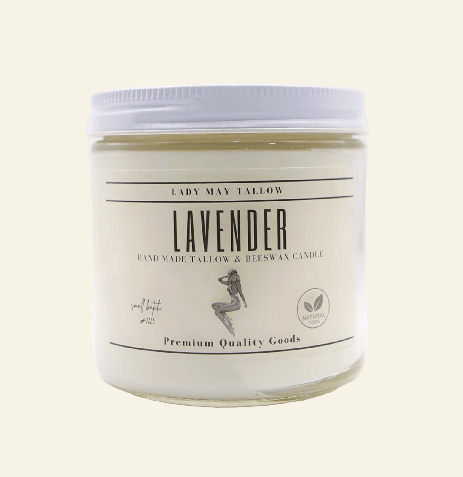 Lavender candle in a glass jar with a white label on a white background