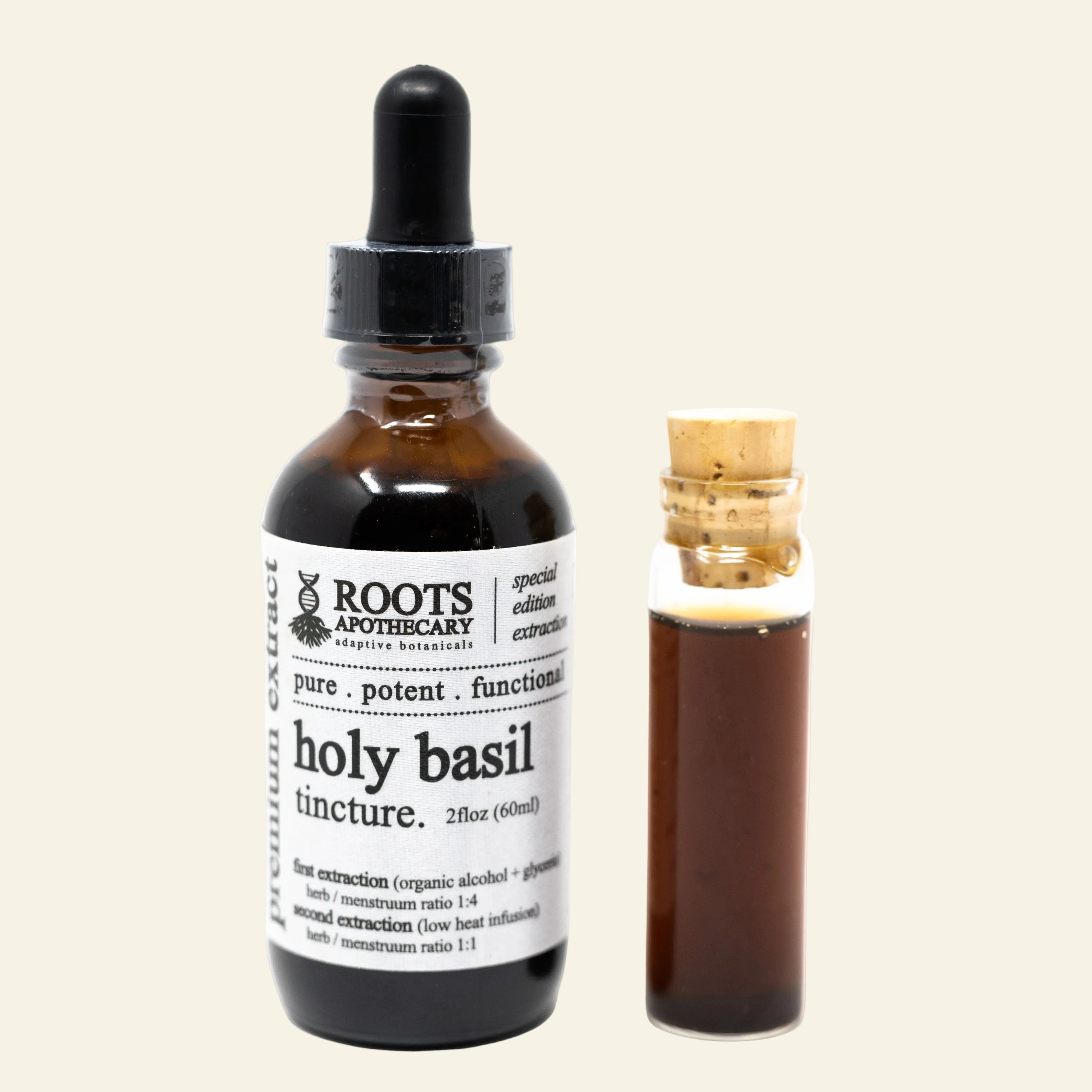 An amber glass dropper bottle labeled Roots Apothecary Holy Basil Tincture next to a small glass vial with a cork stopper containing the dark herbal extract, on a white background.