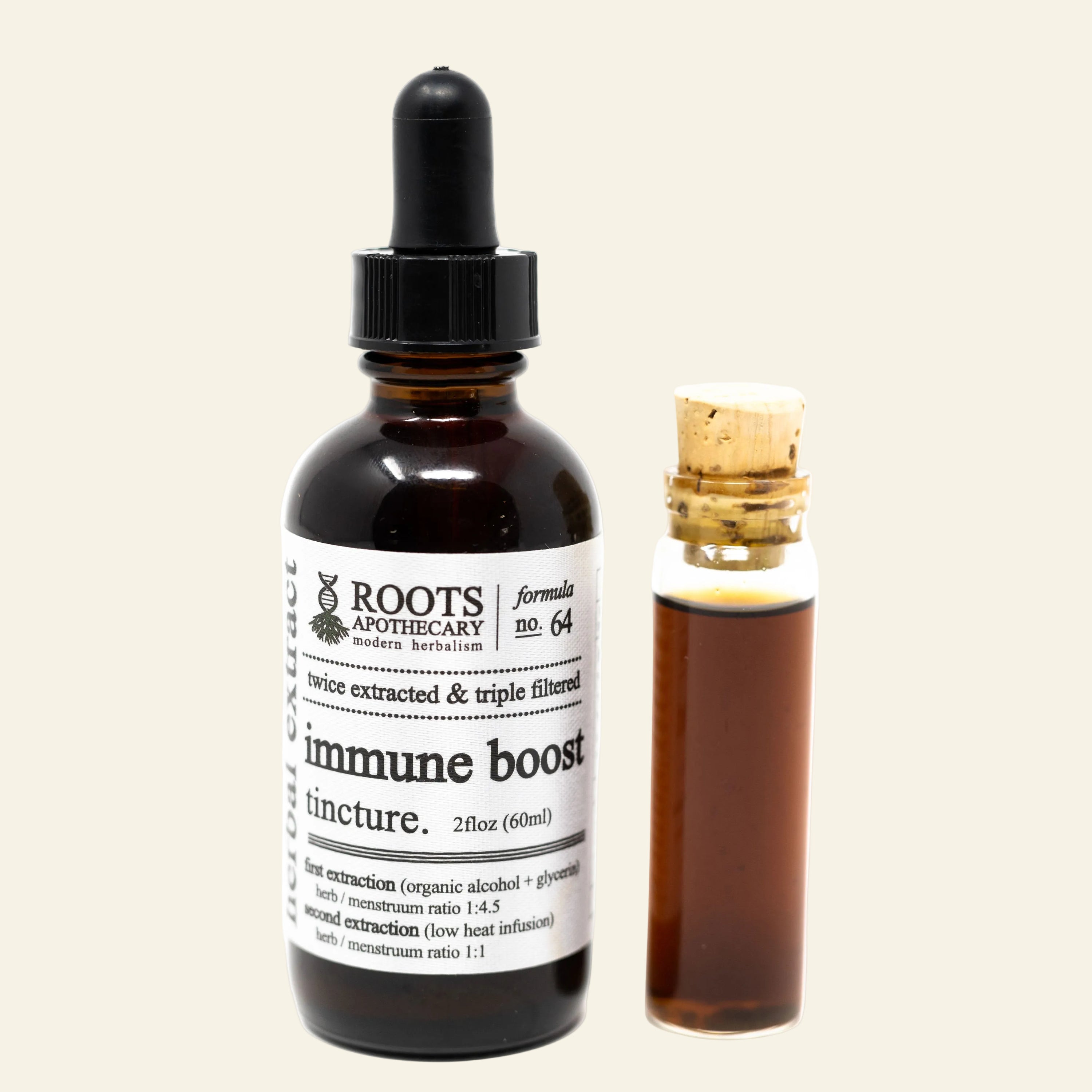 Bottle of immune boost tincture from Roots Apothecary on a white background