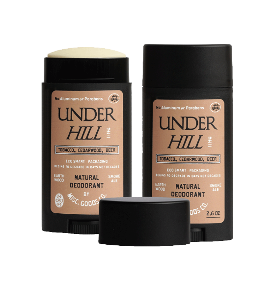 Two Under Hill natural deodorants with black caps on a white background