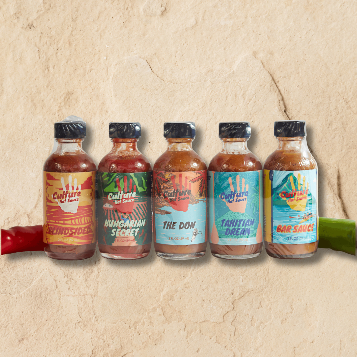 Five bottles of Culture Hot Sauces on a textured beige background