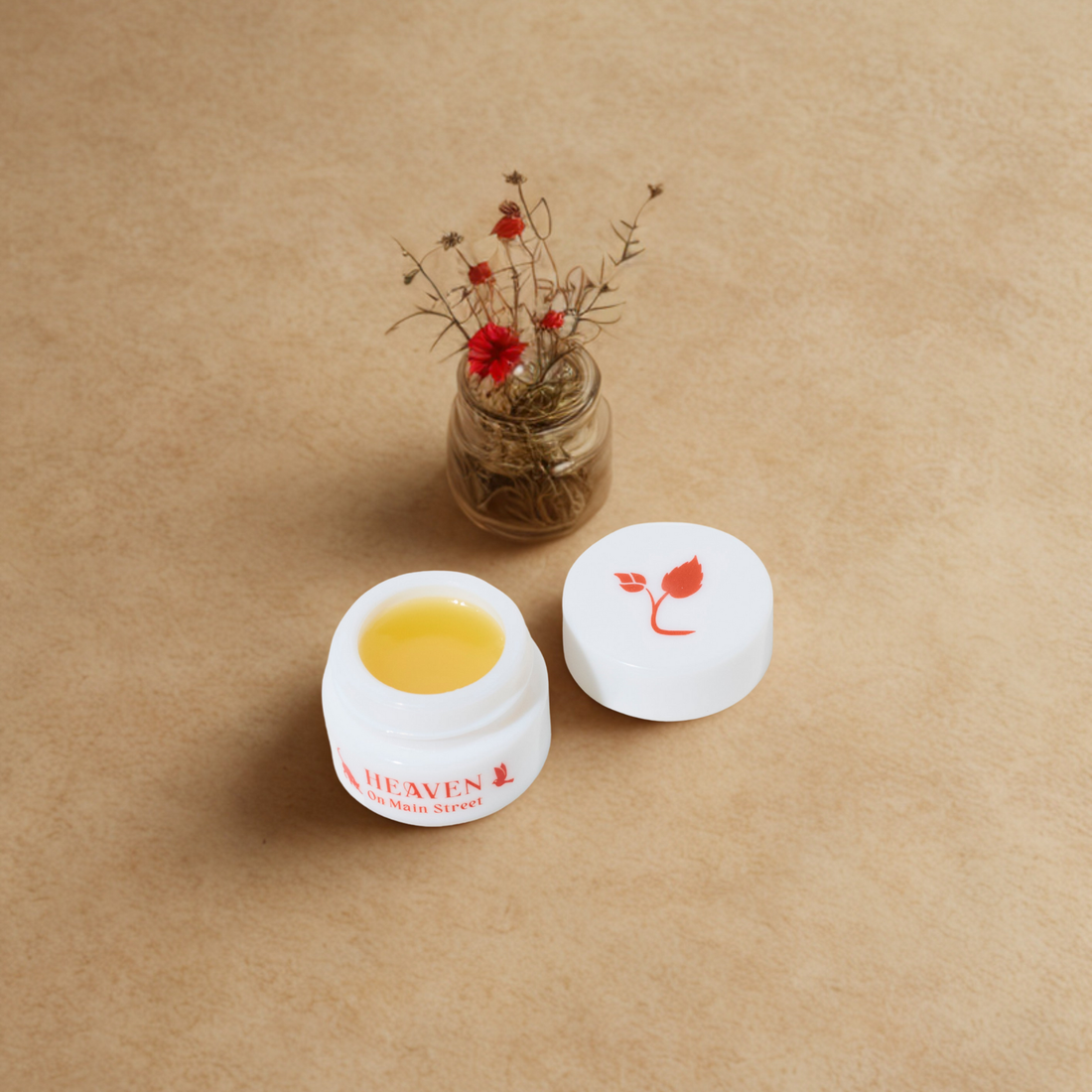 Natural eye cream balm in white opal jar with botanical ingredients