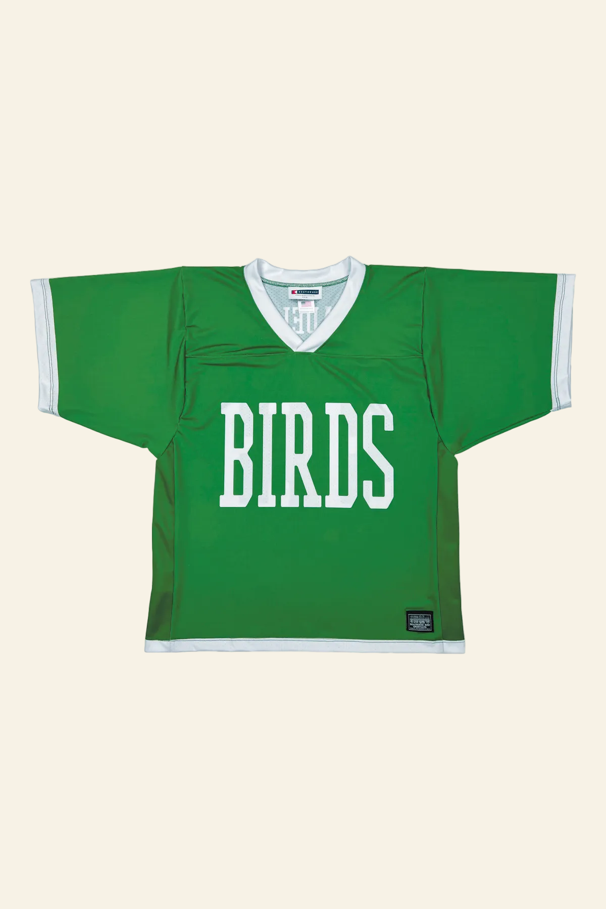 A green short-sleeve hockey-style jersey with white trim and the word &