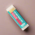 Lip balm with a colorful label on a white background