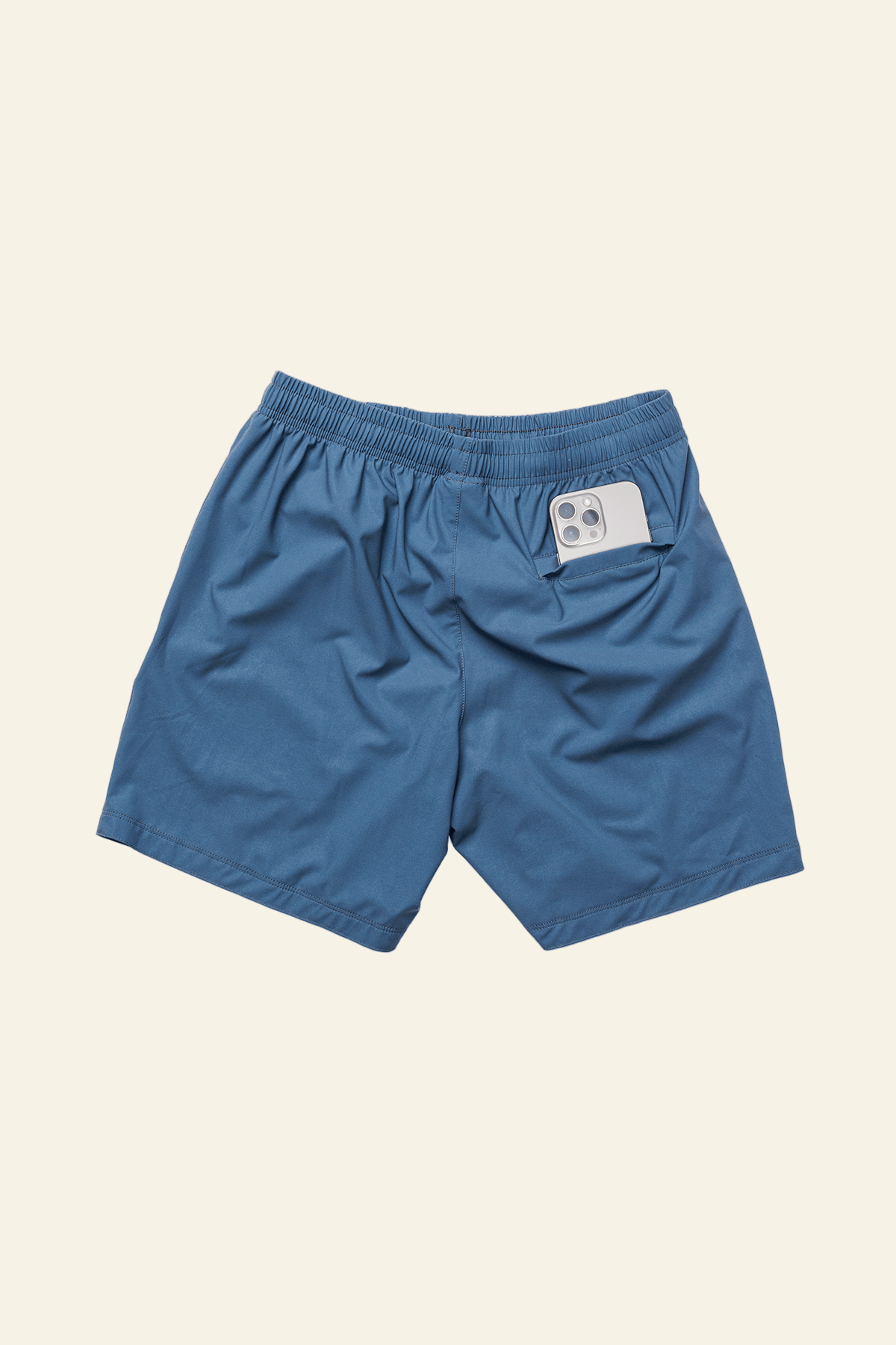 Blue shorts with a label on a white background