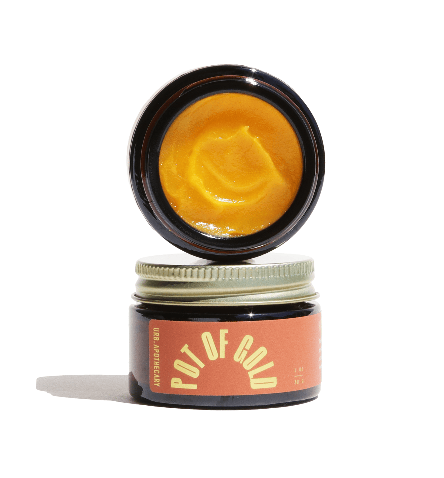 Jar of yellow cream with &