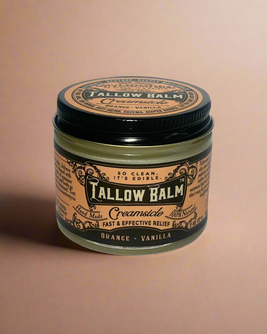 Tallow Balm jar with black lid on a white background