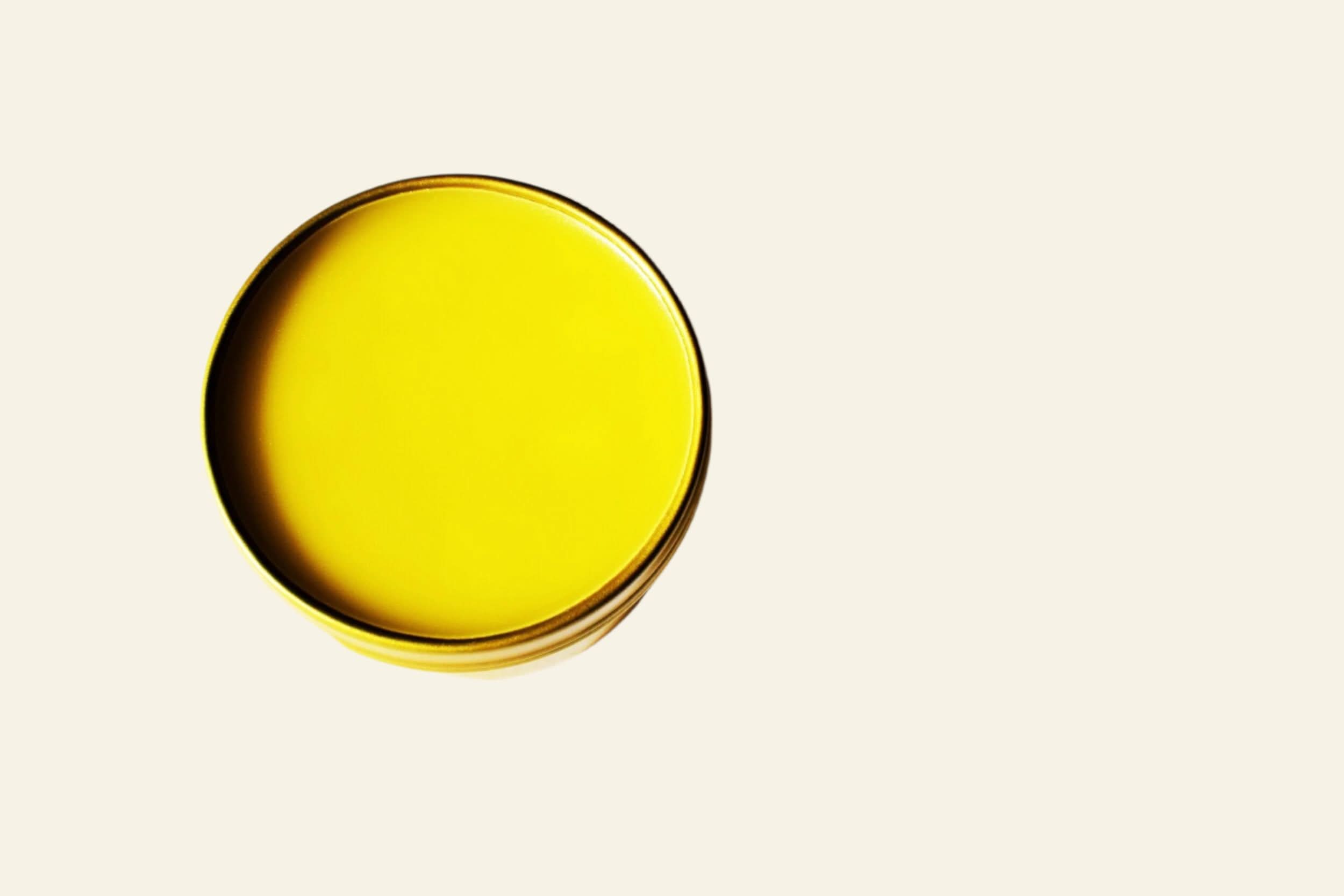 Black and yellow cylindrical container on a white background