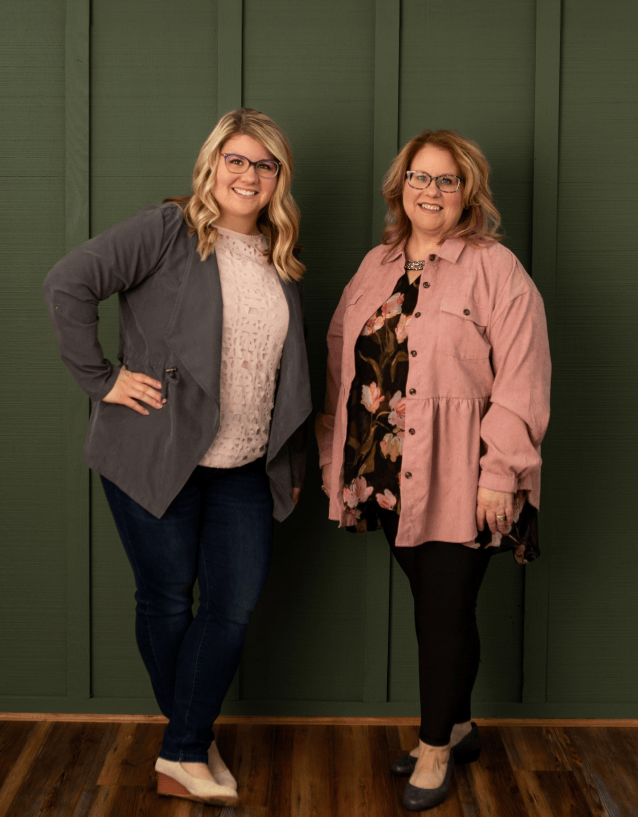 Founders of simply stated standing against a green wall