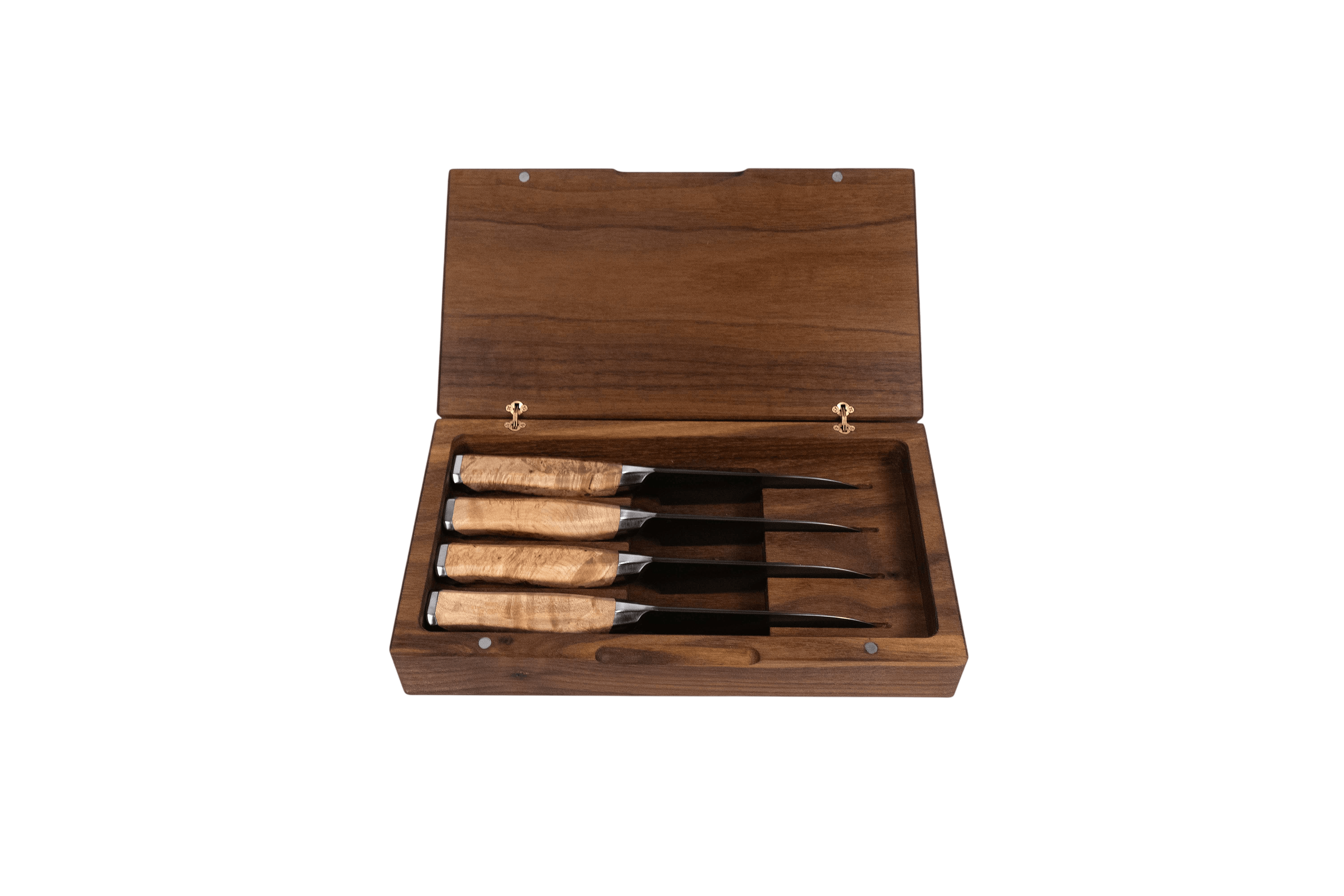 Set of four steak knives in a wooden box on a white background