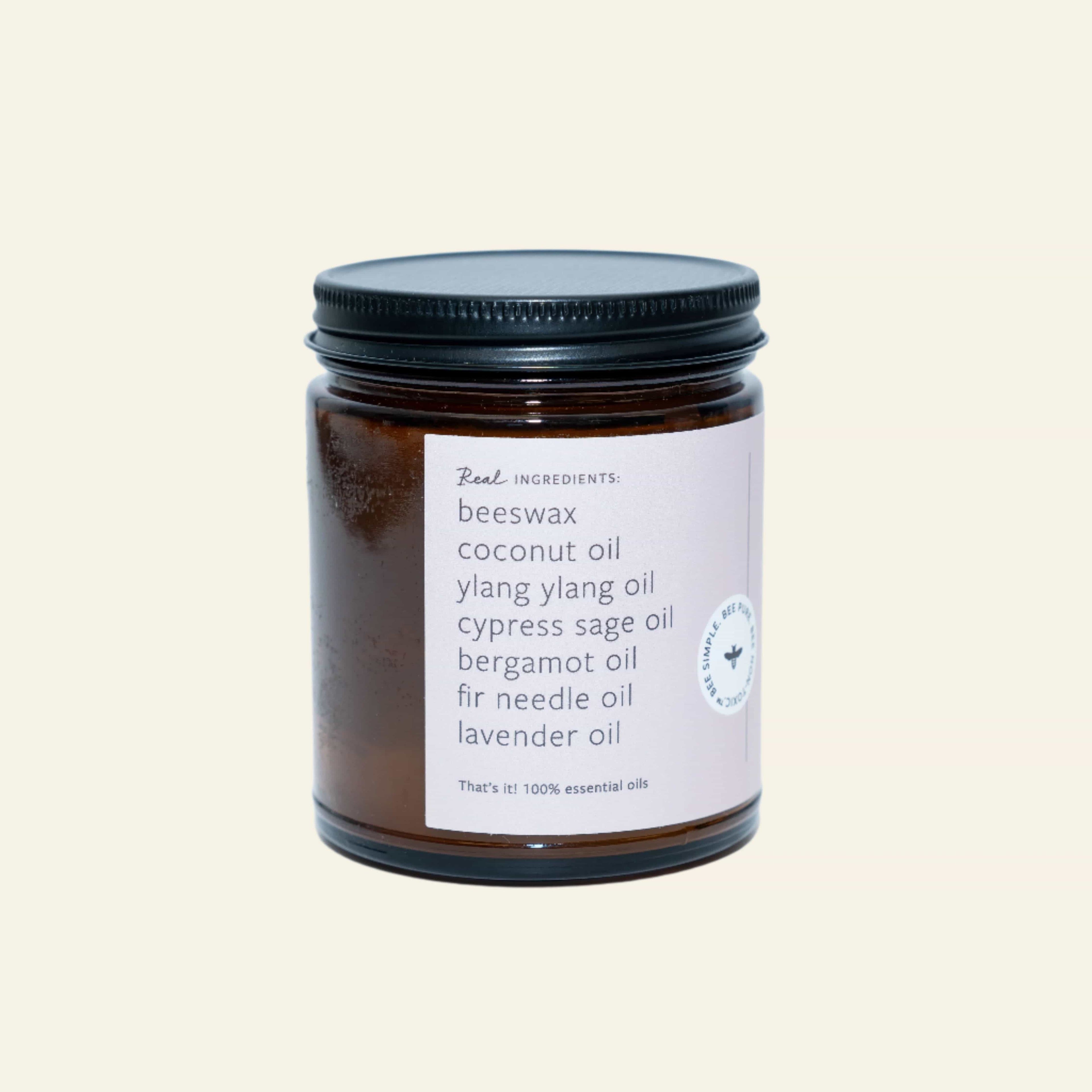 Jar of candle with a label on a white background