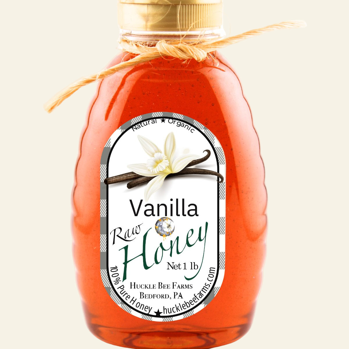 Bottle of vanilla honey with a label on a white background
