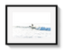 Framed photograph of a surfer riding a wave on a white background